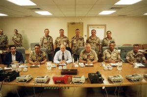The Gulf War set the stage for new era of unrestrained U.S. hegemony. Here, Paul Wolfowitz (left) and Dick Cheney (third from left) meet with military leaders in 1990